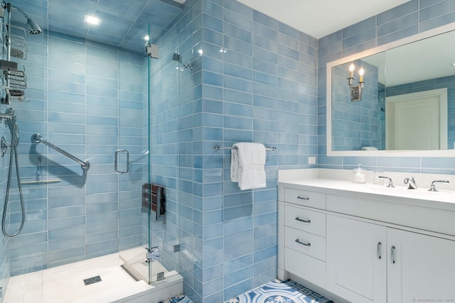 1060 Harbor Rd, Fairfield, CT 06890 - bathroom with tile walls, a shower stall, and vanity