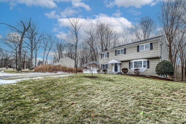 view of front of home featuring a front yard