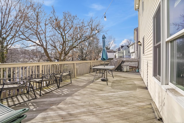 wooden terrace with a baseboard radiator