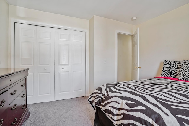 carpeted bedroom featuring a closet