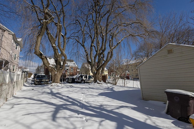 view of yard layered in snow