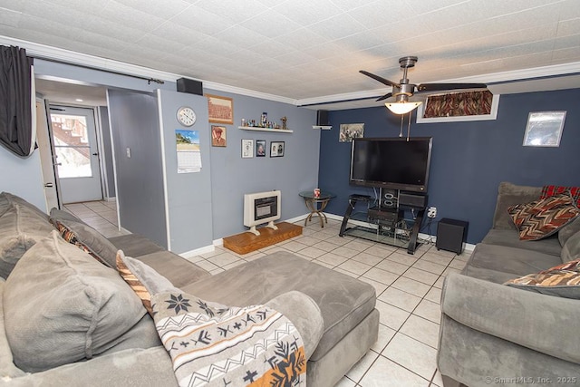 living room with light tile patterned flooring, ceiling fan, crown molding, and heating unit