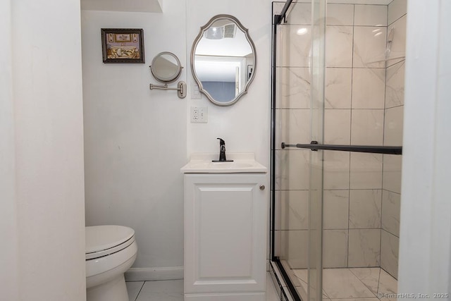 bathroom with vanity, an enclosed shower, and toilet