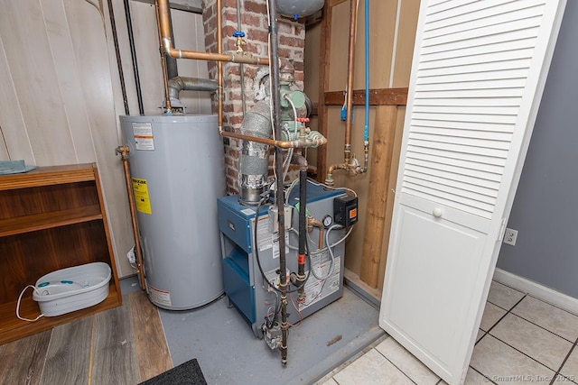 utility room with gas water heater