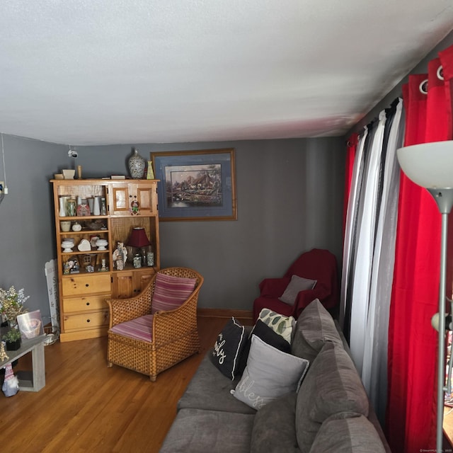 living area with hardwood / wood-style flooring