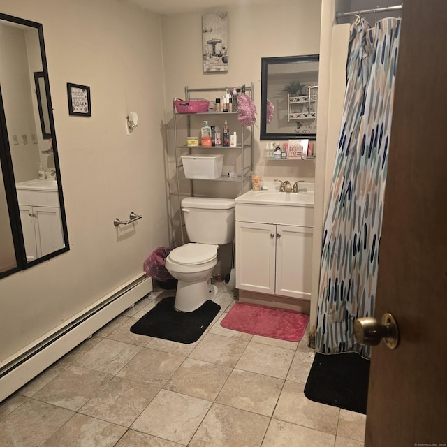 bathroom featuring a baseboard radiator, vanity, tile patterned floors, and toilet