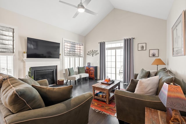 living room featuring ceiling fan, dark hardwood / wood-style flooring, and high vaulted ceiling