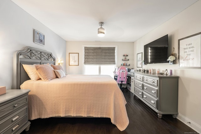 bedroom featuring ceiling fan and dark hardwood / wood-style flooring