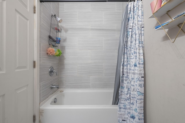 bathroom with shower / bath combination with curtain