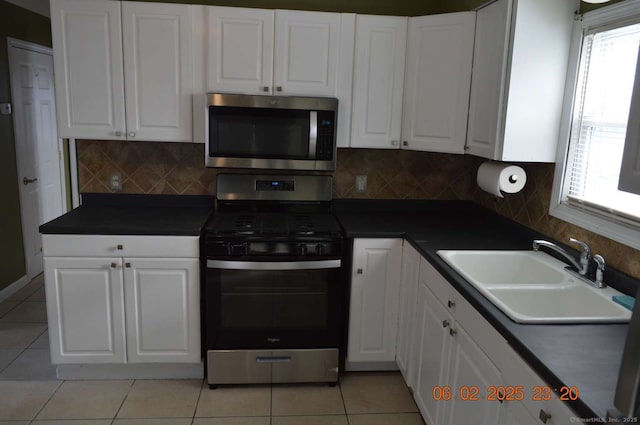 kitchen featuring white cabinetry, sink, tasteful backsplash, and appliances with stainless steel finishes