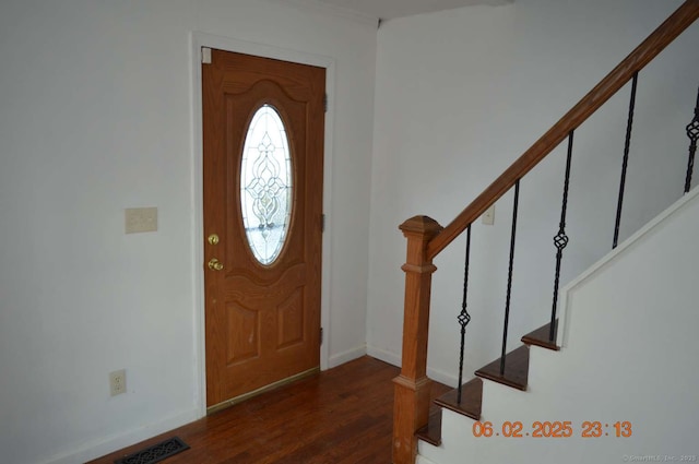 entryway featuring dark wood-type flooring