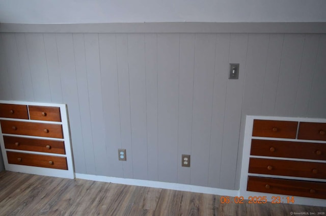 spare room with wood-type flooring