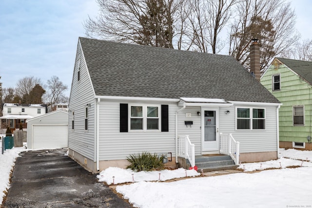 view of front of house with an outbuilding and a garage