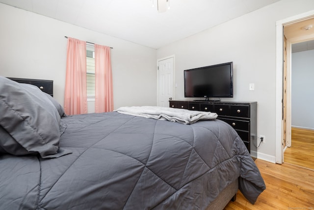 bedroom with wood-type flooring