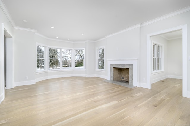 40 Hoyclo Rd, Stamford, CT 06903 - unfurnished living room with a fireplace, baseboards, crown molding, and light wood-style flooring