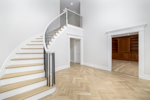 40 Hoyclo Rd, Stamford, CT 06903 - staircase featuring a high ceiling and baseboards