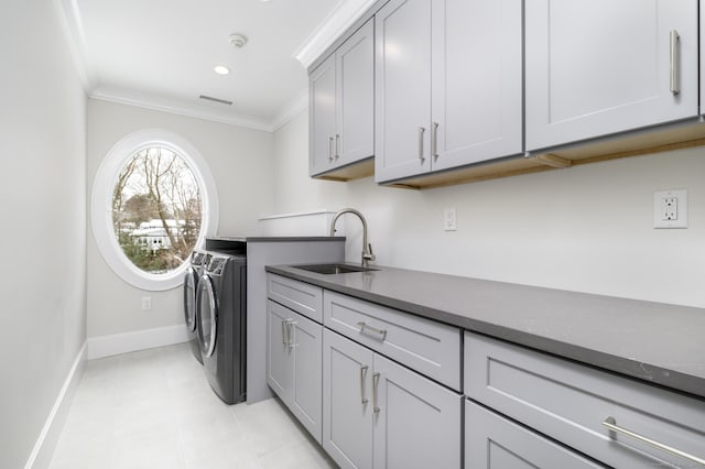 40 Hoyclo Rd, Stamford, CT 06903 - washroom featuring a sink, baseboards, cabinet space, separate washer and dryer, and crown molding