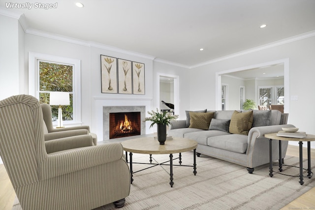 40 Hoyclo Rd, Stamford, CT 06903 - living room with light wood-type flooring, recessed lighting, a lit fireplace, and crown molding