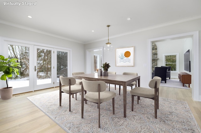 40 Hoyclo Rd, Stamford, CT 06903 - dining area with crown molding, a healthy amount of sunlight, visible vents, and light wood finished floors