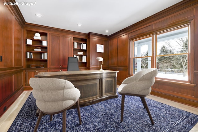 40 Hoyclo Rd, Stamford, CT 06903 - home office with built in desk, recessed lighting, wood walls, light wood finished floors, and ornamental molding