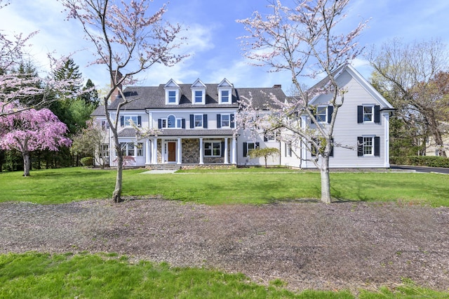 40 Hoyclo Rd, Stamford, CT 06903 - view of front facade with covered porch and a front yard