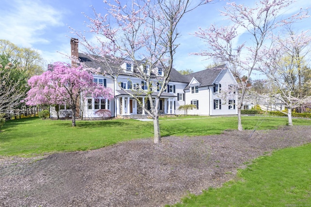 40 Hoyclo Rd, Stamford, CT 06903 - view of front of house with a porch, a chimney, and a front yard