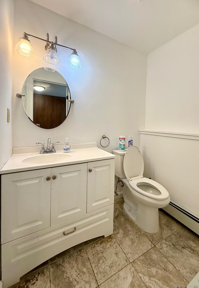 bathroom with vanity, a baseboard radiator, and toilet