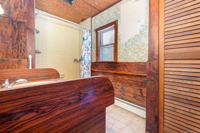 bathroom with a baseboard radiator