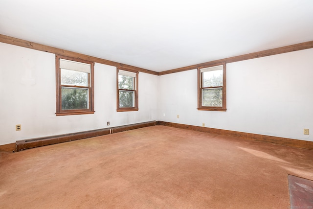 unfurnished room featuring a baseboard radiator, plenty of natural light, and carpet