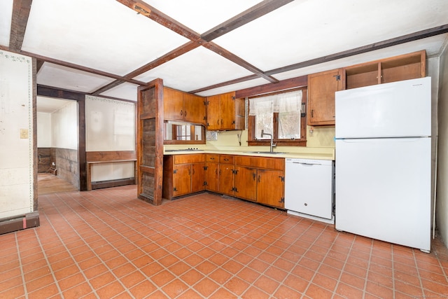 kitchen with white appliances, coffered ceiling, and sink