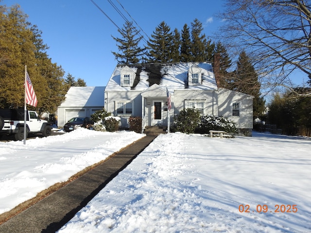 new england style home with a garage