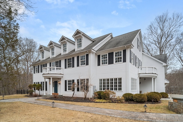 view of front of house with a balcony