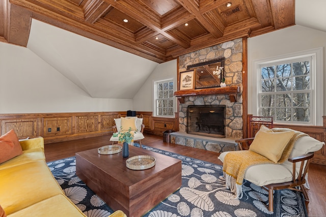 living area with lofted ceiling with beams, wooden ceiling, a wainscoted wall, a fireplace, and wood finished floors