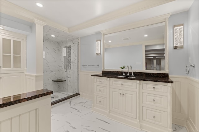 bathroom with recessed lighting, vanity, marble finish floor, wainscoting, and a marble finish shower