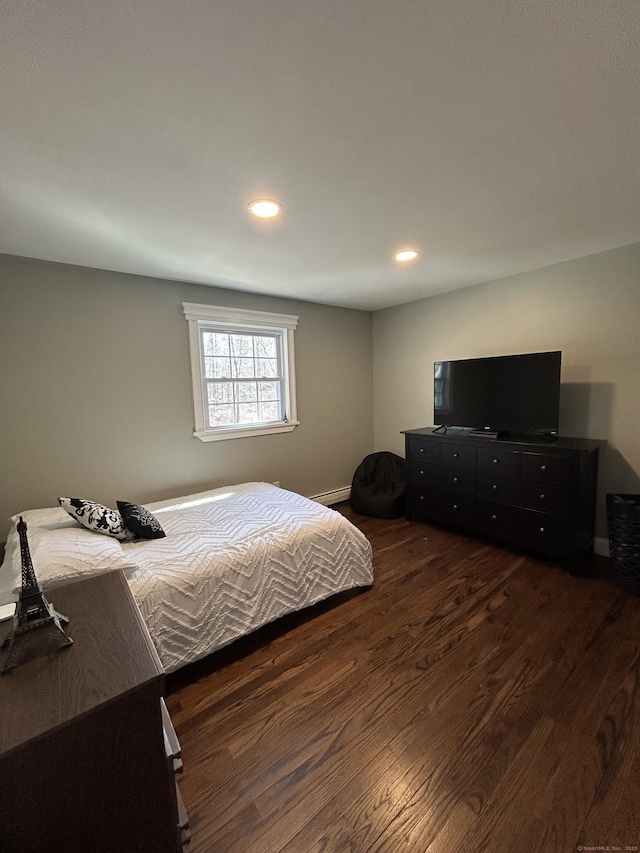 bedroom featuring recessed lighting and wood finished floors