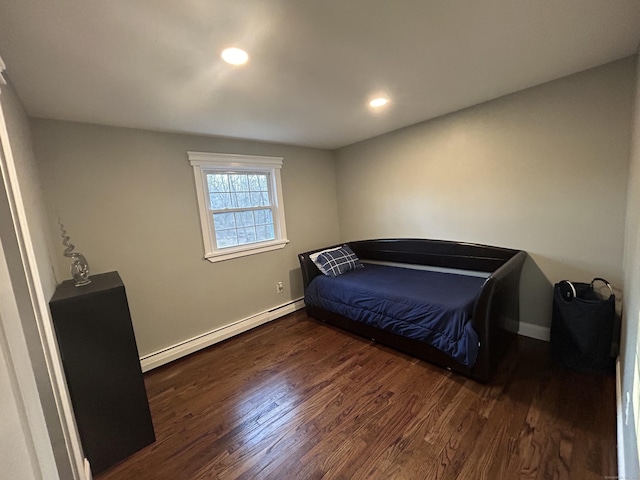 bedroom featuring recessed lighting, a baseboard heating unit, baseboards, and dark wood-type flooring