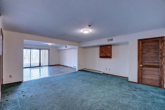 tiled empty room featuring visible vents, a textured ceiling, carpet floors, baseboards, and baseboard heating