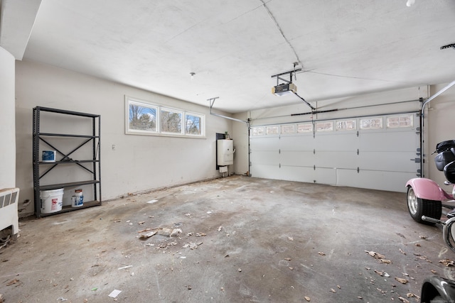 garage with water heater and a garage door opener