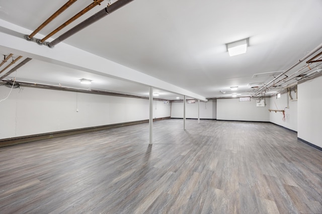 basement with wood-type flooring