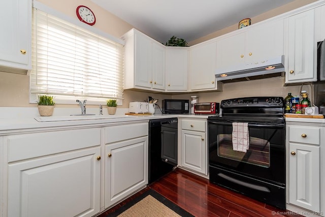 kitchen with white cabinetry, dark wood-type flooring, and black appliances