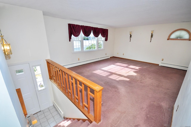 entrance foyer with a baseboard radiator and carpet