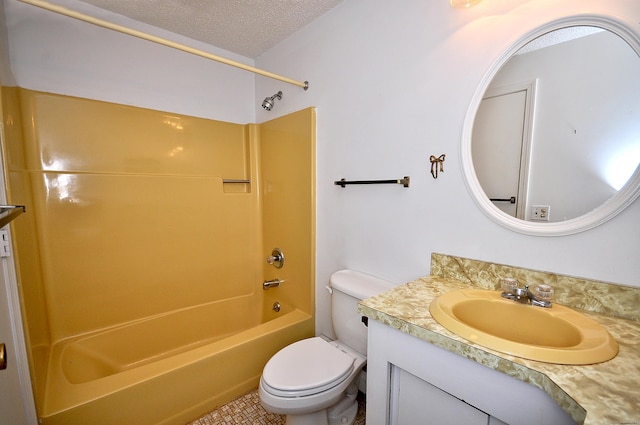 full bathroom with vanity, toilet, bathing tub / shower combination, and a textured ceiling