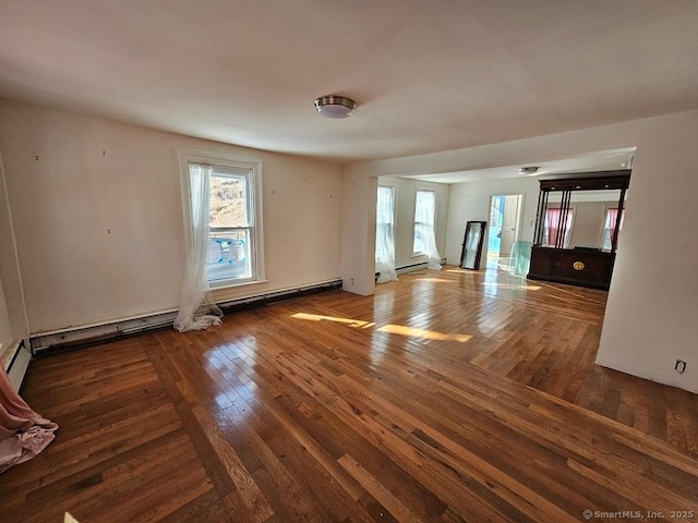 empty room featuring hardwood / wood-style flooring and plenty of natural light