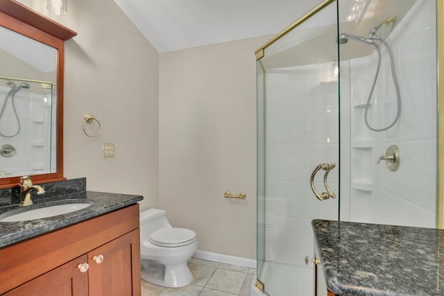 full bathroom with toilet, baseboards, lofted ceiling, a shower stall, and vanity