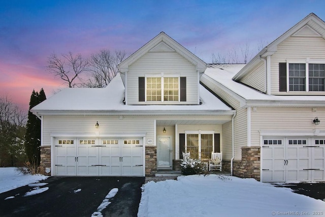 view of front of property featuring a garage and covered porch