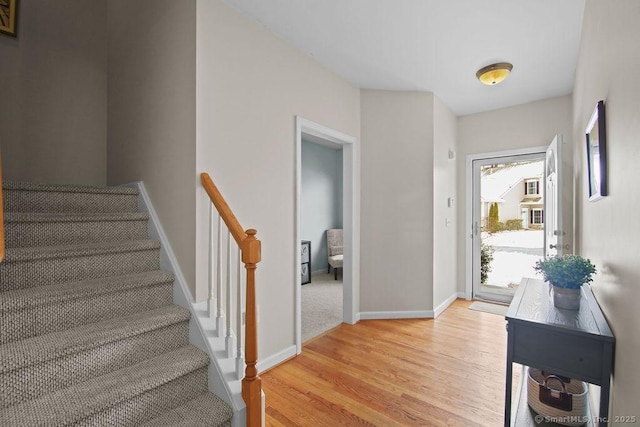 foyer entrance with light hardwood / wood-style flooring