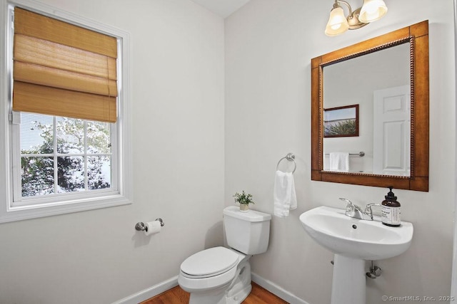 bathroom featuring sink and toilet