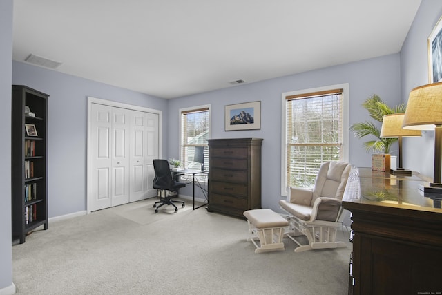 home office with light carpet and a wealth of natural light