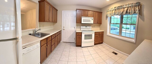 4 Amberly Ln Unit 4, East Lyme, CT 06357 - kitchen featuring white appliances, a sink, light countertops, and brown cabinets