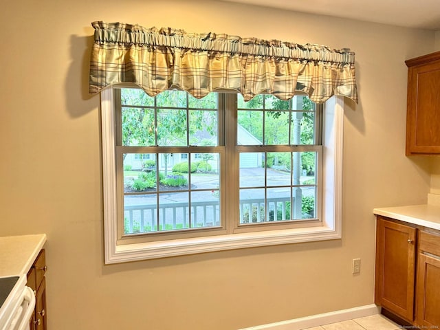4 Amberly Ln Unit 4, East Lyme, CT 06357 - dining space featuring healthy amount of natural light, light tile patterned floors, and baseboards